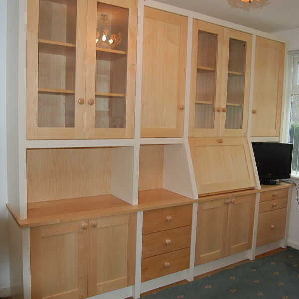 bespoke unit in veneered and solid maple with a painted surround to highlight the display and bureau